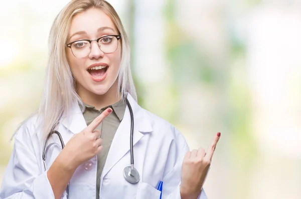 Young Blonde Doctor Woman Isolated Background Smiling Looking Camera Pointing — Stock Photo, Image