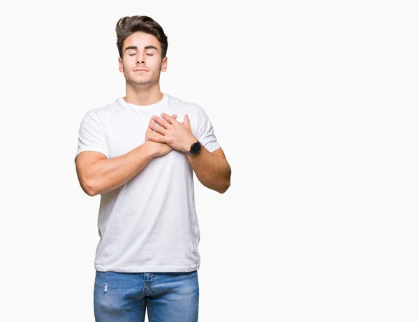 Mladý Pohledný Muž Sobě Bílé Tričko Izolované Pozadí Úsměvem Ruce — Stock fotografie