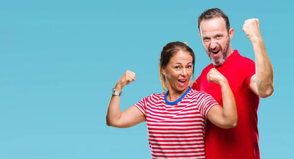 Middle Age Hispanic Couple Love Isolated Background Showing Arms Muscles — Stock Photo, Image