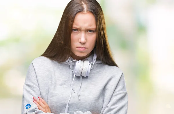 Junge Schöne Kaukasische Studentin Mit Kopfhörern Über Isoliertem Hintergrund Skeptisch — Stockfoto