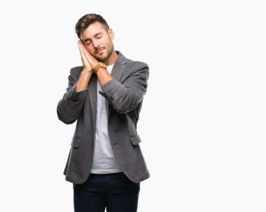 Genç yakışıklı iş adamı uyku yorgun hayal ve ile gülümseyen gözleri kapalı iken ellerle birlikte poz izole arka plan üzerinde.