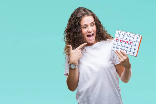 Young Brunette Girl Holding Menstruation Calendar Isolated Background Very Happy — Stock Photo, Image
