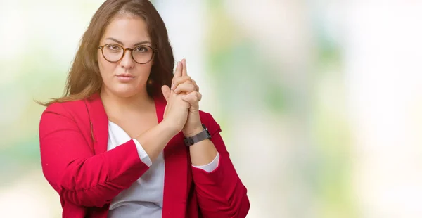 Beautiful plus size young business woman wearing elegant jacket and glasses over isolated background Holding symbolic gun with hand gesture, playing killing shooting weapons, angry face