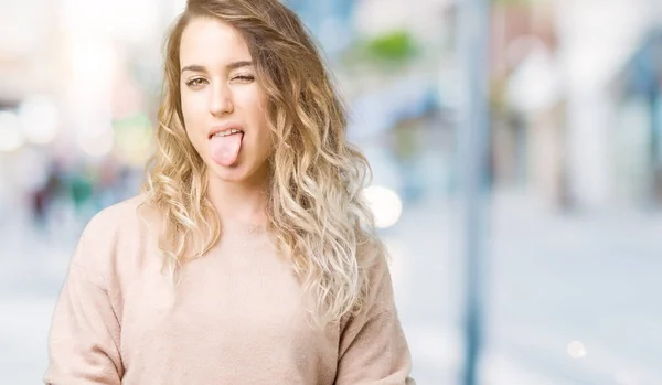 Beautiful Young Blonde Woman Wearing Sweatershirt Isolated Background Sticking Tongue — Stock Photo, Image