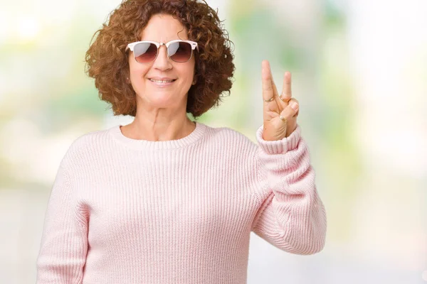 Beautiful Middle Ager Senior Woman Wearing Pink Sweater Sunglasses Isolated — Stock Photo, Image