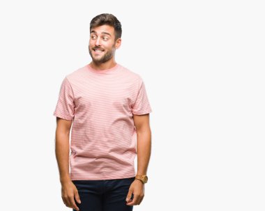 Yakışıklı delikanlı görünümlü yan ve dik dik bakma uzağa düşünce gülümseyen izole arka plan üzerinde.