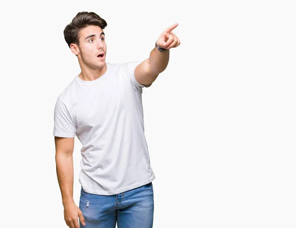 Joven Hombre Guapo Con Camiseta Blanca Sobre Fondo Aislado Señalando —  Fotos de Stock