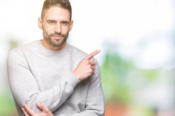 Joven Hombre Guapo Con Sudadera Sobre Fondo Aislado Señalando Con — Foto de Stock