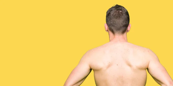 Handsome Shirtless Man Showing Nude Chest Standing Backwards Looking Away — Stock Photo, Image