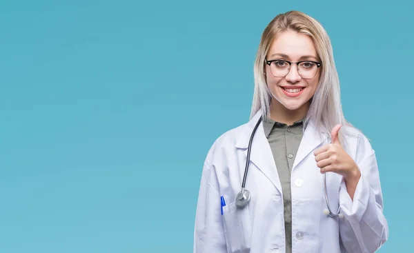 Young Blonde Doctor Woman Isolated Background Doing Happy Thumbs Gesture — Stock Photo, Image