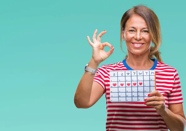 Mulher Hispânica Sênior Meia Idade Segurando Calendário Menstruação Sobre Fundo — Fotografia de Stock