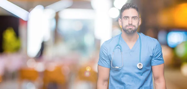 Gutaussehender Junger Arzt Chirurg Mann Über Isoliertem Hintergrund Aufgeblasene Wangen — Stockfoto