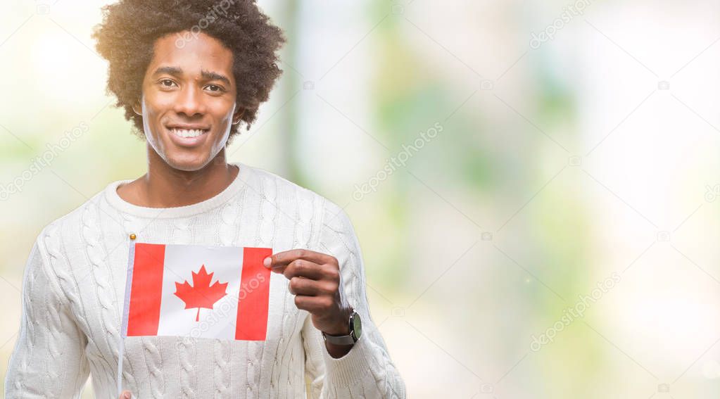 Afro american man flag of Canada over isolated background with a happy face standing and smiling with a confident smile showing teeth