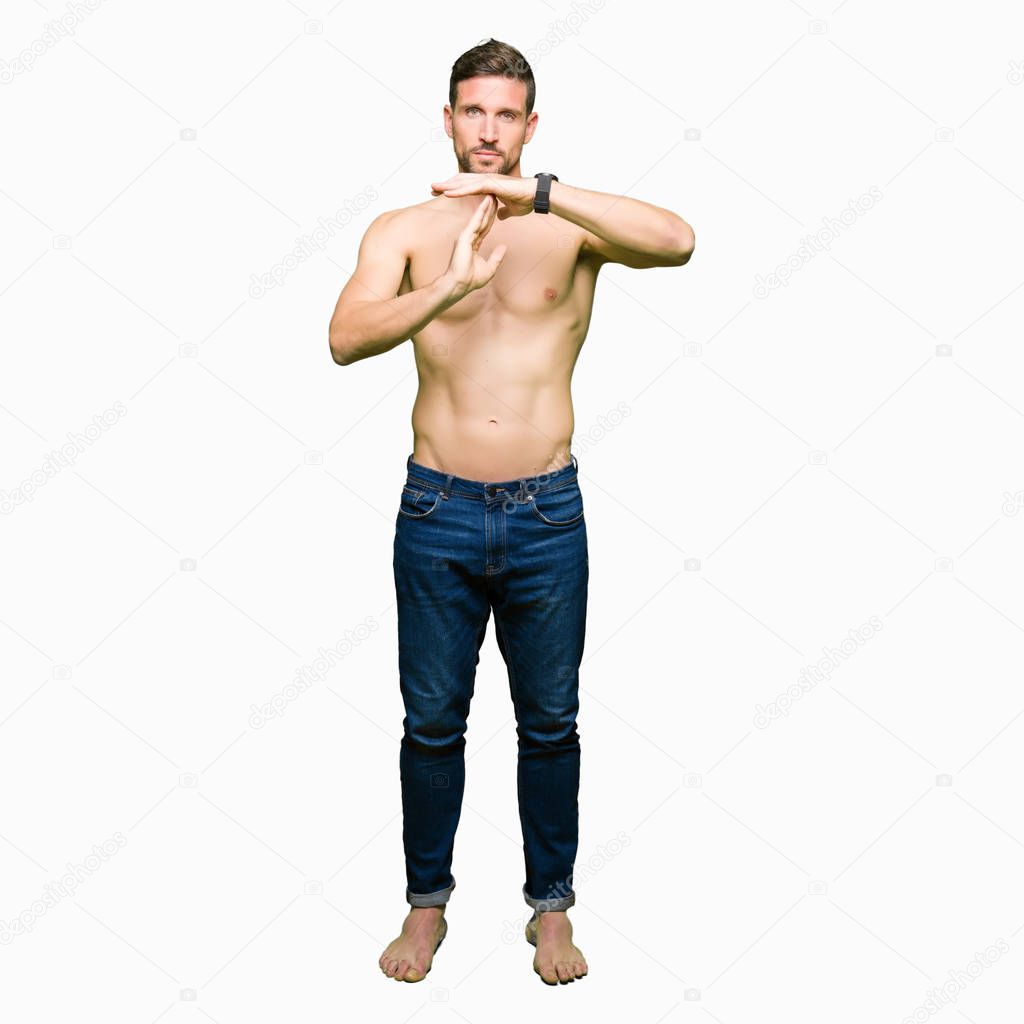 Handsome shirtless man showing nude chest Doing time out gesture with hands, frustrated and serious face