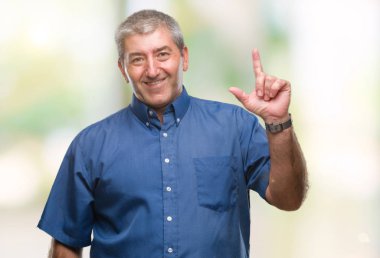 Başarılı fikirle parmağı yukarıyı izole arka plan üzerinde yakışıklı komuta sizde. Çıktıktan ve mutlu. Bir numara.