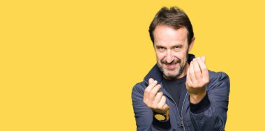 Maaş ödeme için milyoner iş soran bir ceket yapmak para hareketi el ile giyen orta yaş yakışıklı adam