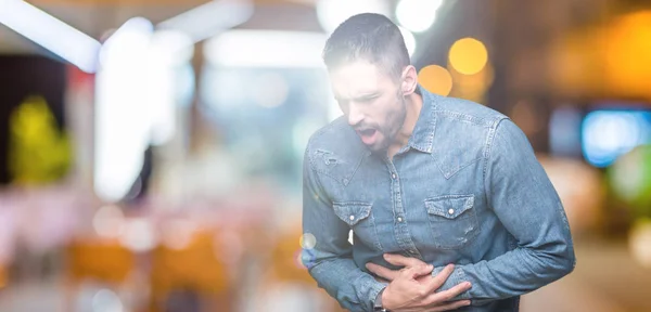 Joven Hombre Guapo Sobre Fondo Aislado Con Mano Estómago Porque — Foto de Stock