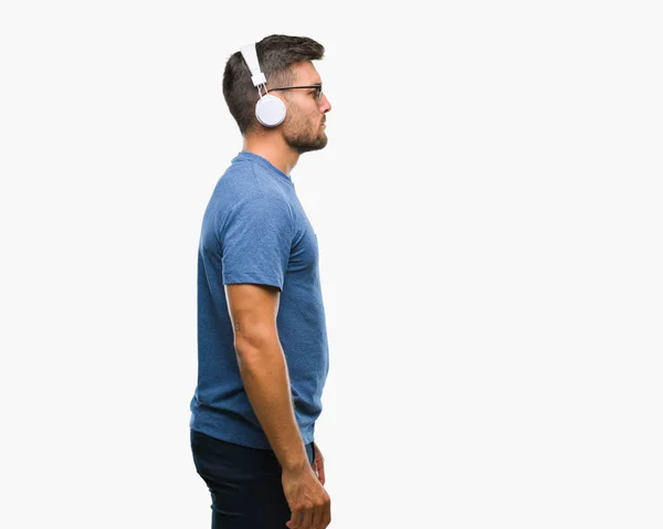 Jonge Knappe Man Dragen Koptelefoon Luisteren Naar Muziek Geïsoleerde Achtergrond — Stockfoto
