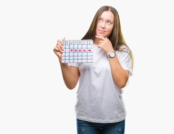 Jonge Kaukasische Vrouw Houdt Van Menstruatie Kalender Geïsoleerde Achtergrond Ernstige — Stockfoto