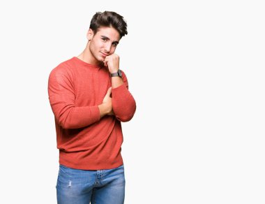 Yakışıklı delikanlı çene düşünme hakkında soru, dalgın ifade üzerine el ile izole arka plan üzerinde. Düşünceli yüzüyle gülümsüyor. Şüphe kavramı.