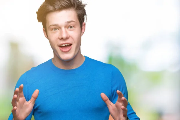 Jovem Homem Bonito Vestindo Camisola Azul Sobre Fundo Isolado Com — Fotografia de Stock