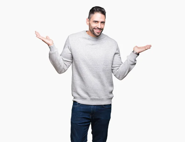 Junger Gutaussehender Mann Der Sweatshirt Über Isoliertem Hintergrund Trägt Und — Stockfoto