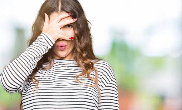 Young Beautiful Woman Wearing Stripes Sweater Peeking Shock Covering Face — Stock Photo, Image