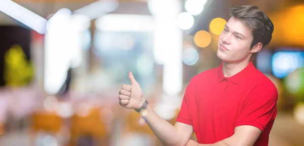 Young Handsome Man Wearing Red Shirt Isolated Background Looking Proud — Stock Photo, Image