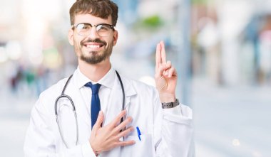 Genç doktor adam giyen hastane kat izole üzerinde arka plan Swearing göğüs ve bir sadakat sözü yemin yapma parmaklar, el ile