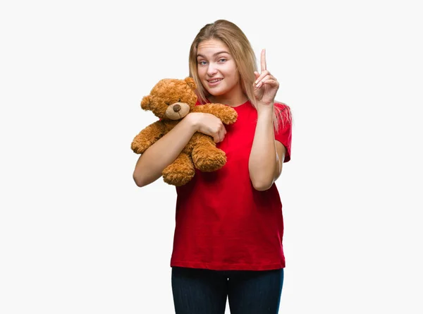 Mladá Žena Kavkazský Hospodářství Roztomilý Teddy Bear Izolované Pozadí Překvapený — Stock fotografie