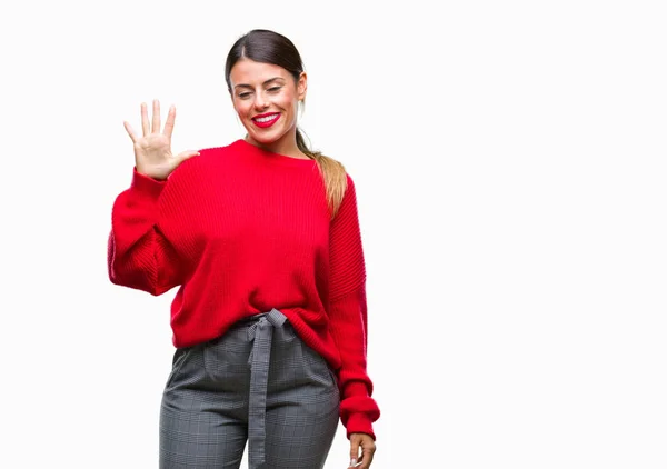 上冬のセーターを着ている若い美しいビジネス女性分離を示す背景と指で上向き数は自信を持って 幸せな笑みを浮かべている間 — ストック写真