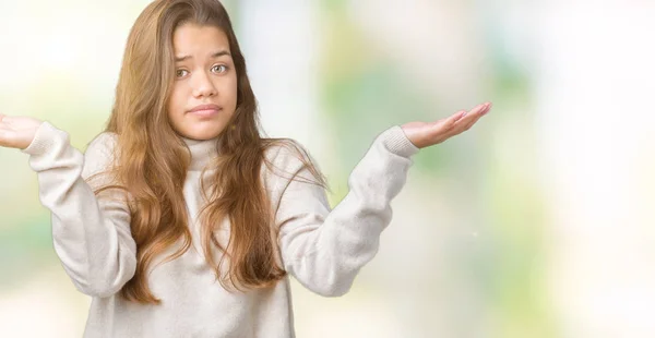 Junge Schöne Brünette Frau Trägt Rollkragenpullover Über Isoliertem Hintergrund Ahnungslosen — Stockfoto