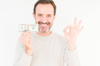 Komuta sizde parmak, mükemmel sembolü ile ok işareti yapıyor izole arka plan üzerinde yirmi dolar banka Not tutarak