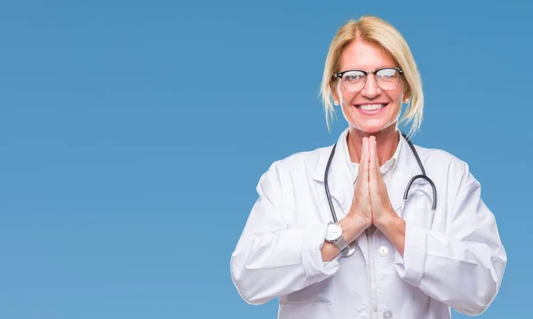 Middle Age Blonde Doctor Woman Isolated Background Praying Hands Together — Stock Photo, Image