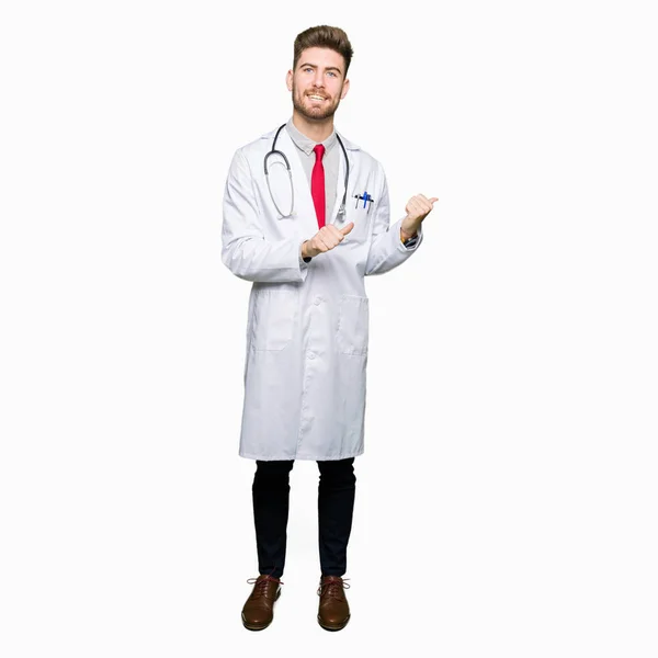 Young Handsome Doctor Man Wearing Medical Coat Pointing Back Hand — Stock Photo, Image