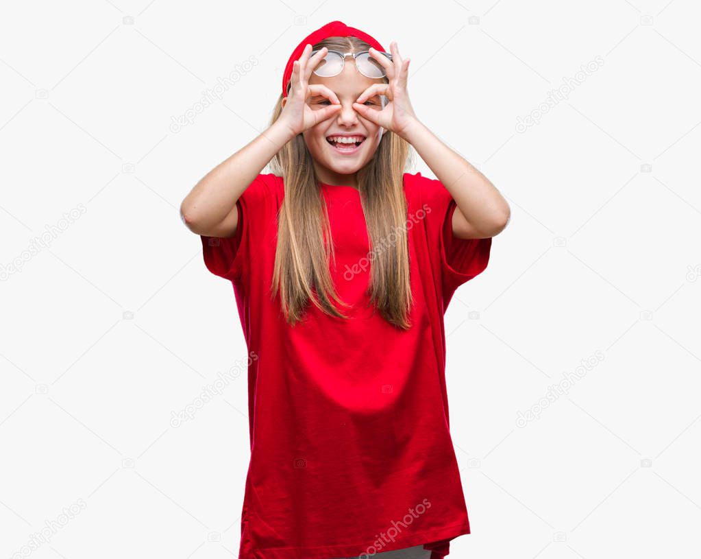 Young beautiful girl wearing glasses over isolated background doing ok gesture like binoculars sticking tongue out, eyes looking through fingers. Crazy expression.