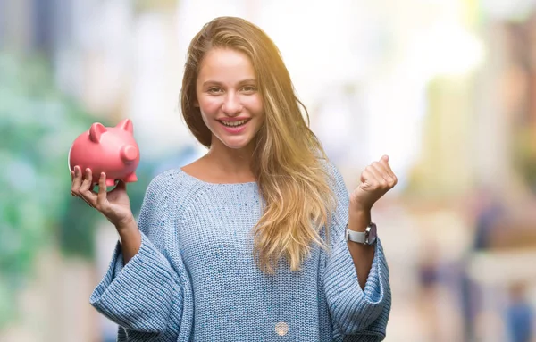 Young Beautiful Blonde Woman Holding Piggy Bank Isolated Background Screaming — Stock Photo, Image