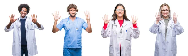 外科医生的一组人在孤立的背景下展示和指着9号手指 同时微笑着自信和快乐 — 图库照片