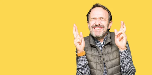 Middle Age Handsome Man Wearing Winter Vest Smiling Crossing Fingers — Stock Photo, Image