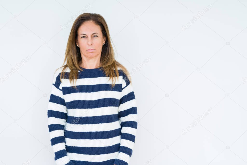Beautiful middle age woman wearing navy sweater over isolated background skeptic and nervous, frowning upset because of problem. Negative person.