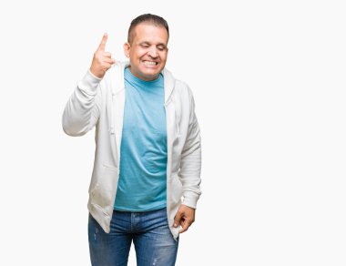 Orta yaş Arap adam başarılı fikirle izole arka plan işaret parmağı üzerinde kazak giyiyor. Çıktıktan ve mutlu. Bir numara.