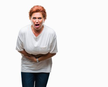 Atrractive üst düzey beyaz Kızıl saçlı kadın izole mide üzerinde el ile arka plan çünkü mide bulantısı, ağrılı hastalık hasta hissediyor. Ağrısı kavramı.