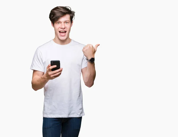 Young Man Using Smartphone Isolated Background Pointing Showing Thumb Side — Stock Photo, Image