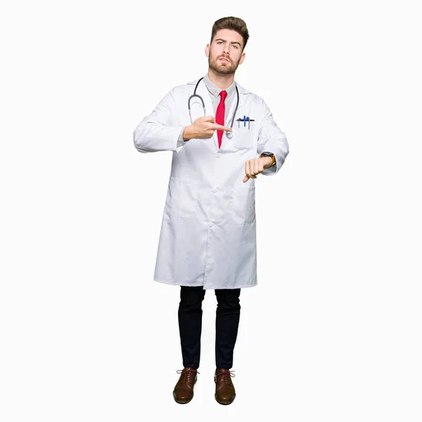 Young Handsome Doctor Man Wearing Medical Coat Hurry Pointing Watch — Stock Photo, Image