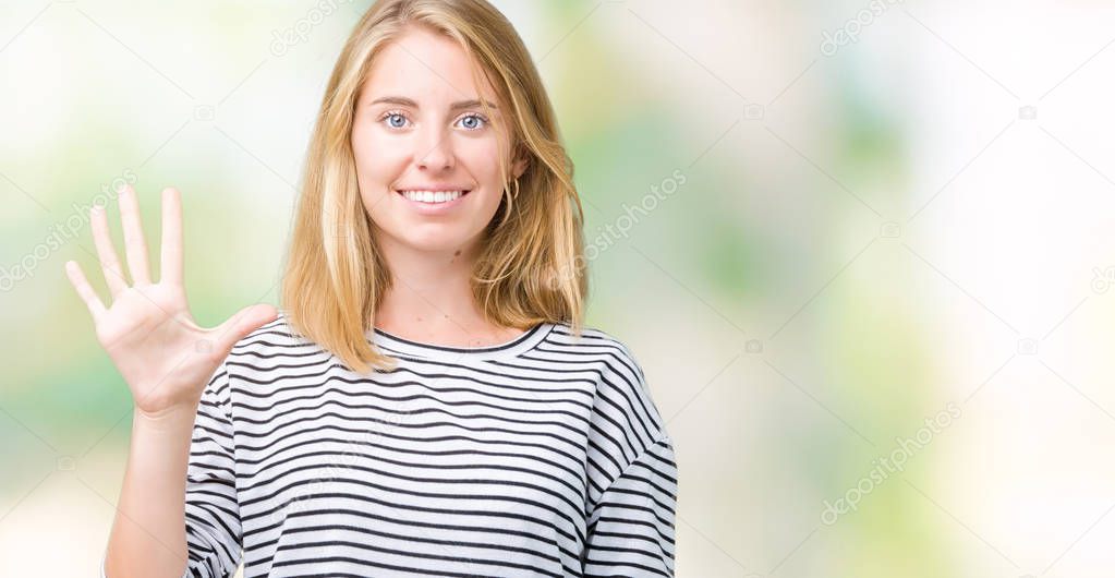 Beautiful young woman wearing stripes sweater over isolated background showing and pointing up with fingers number five while smiling confident and happy.