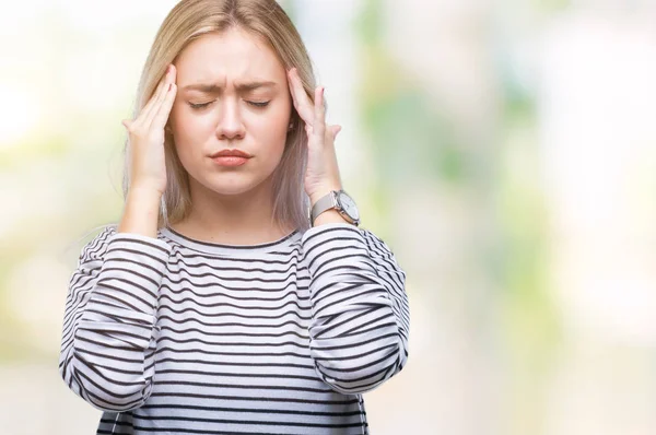 Young blonde woman over isolated background with hand on head for pain in head because stress. Suffering migraine.