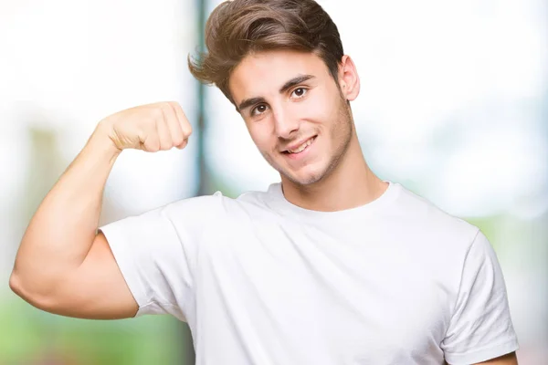 Ung Vacker Man Klädd Vit Shirt Över Isolerade Bakgrund Stark — Stockfoto