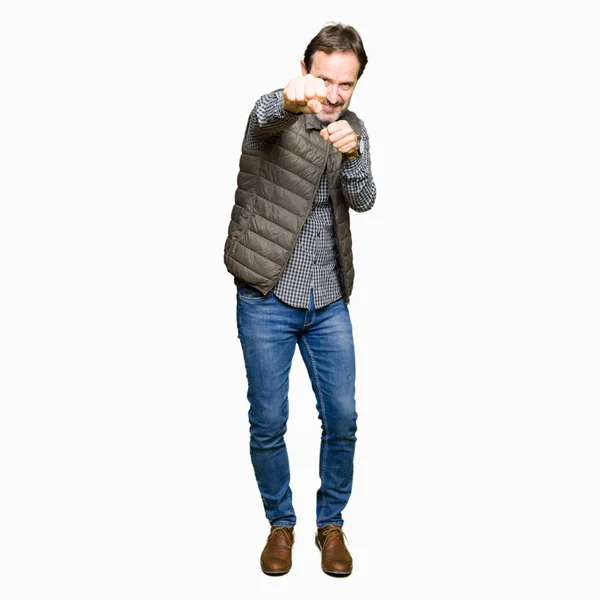 Middle Age Handsome Man Wearing Winter Vest Punching Fist Fight — Stock Photo, Image