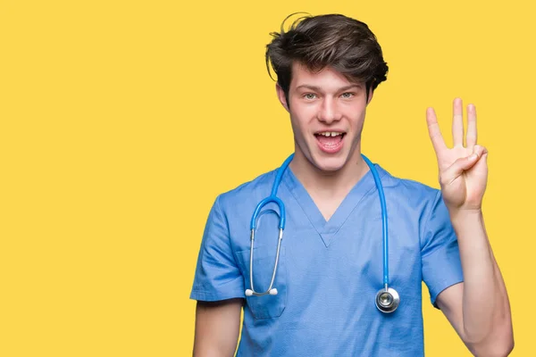 Mladý Lékař Lékařské Uniformě Izolované Pozadí Zobrazení Směřující Nahoru Prsty — Stock fotografie