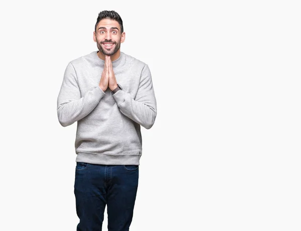 Jovem Homem Bonito Vestindo Camisola Sobre Fundo Isolado Orando Com — Fotografia de Stock